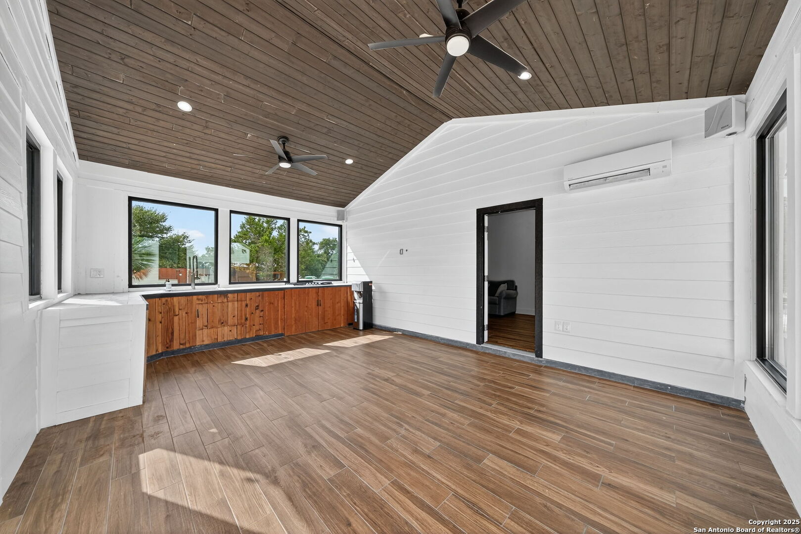 1115 Meadow Stone Court Spring Branch, TX 78070 - Photo 36 of 42 a view of an empty room with wooden floor and a window