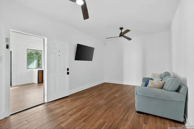 a bed room with a bed mirror and a window