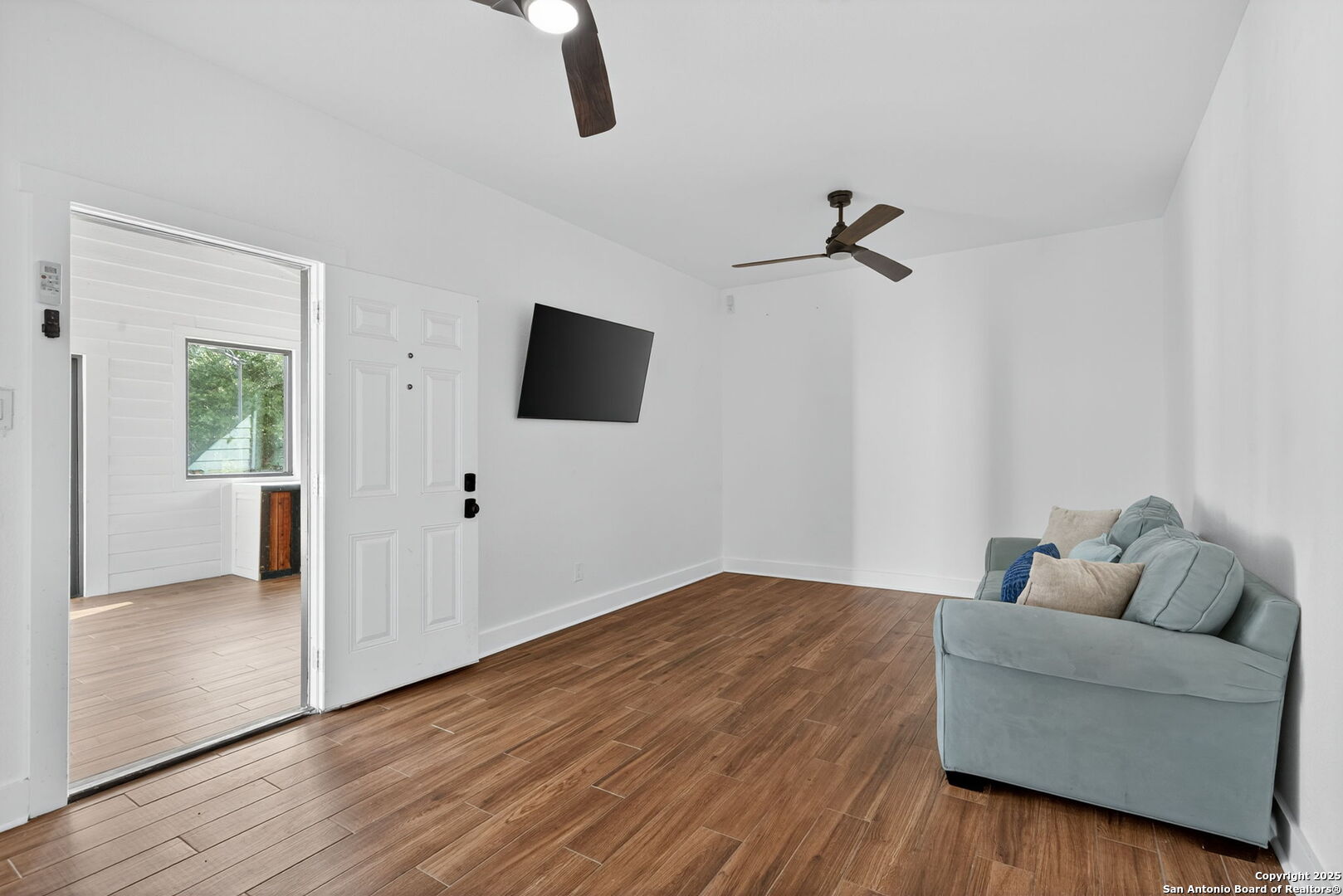 1115 Meadow Stone Court Spring Branch, TX 78070 - Photo 37 of 42 a living room with furniture and a flat screen tv