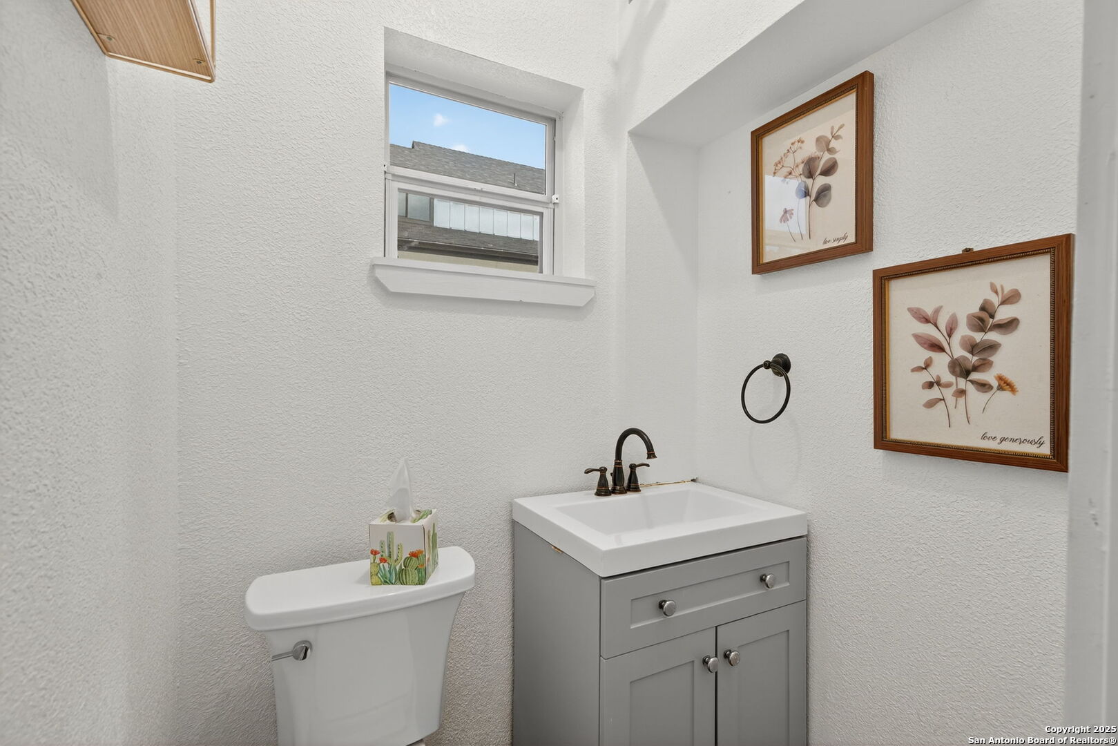 1115 Meadow Stone Court Spring Branch, TX 78070 - Photo 39 of 42 a bathroom with a toilet sink and mirror