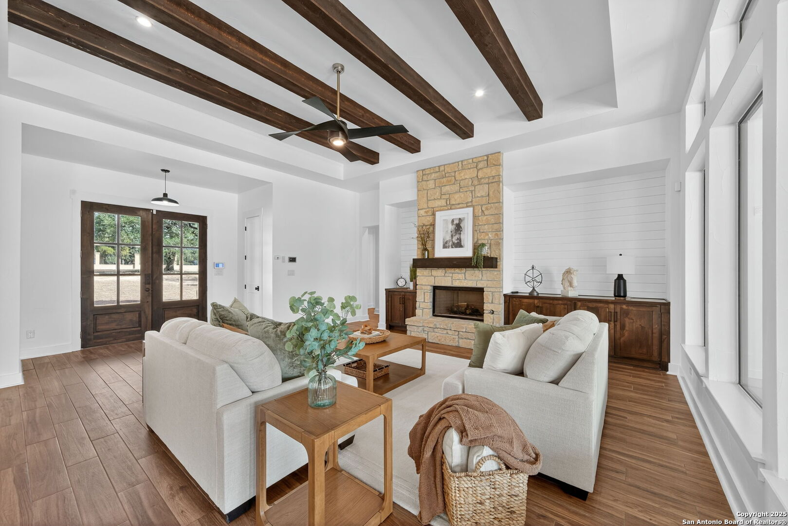 1115 Meadow Stone Court Spring Branch, TX 78070 - Photo 5 of 42 a living room with furniture and a fireplace