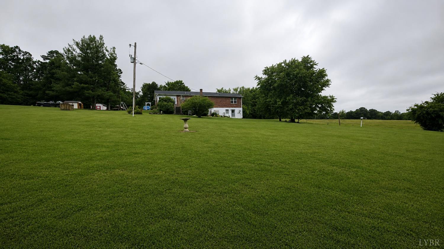 2346 Mitchell Mill Road Gladys, VA 24554 - Photo 23 of 38 a view of a grassy field with trees