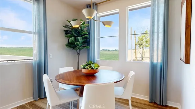 a dining room with furniture and window