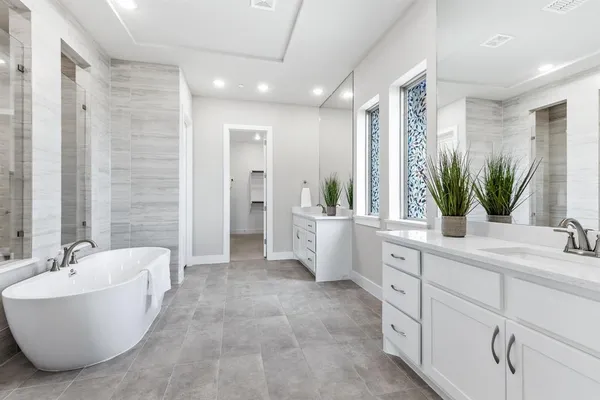 a bathroom with a bathtub and shower
