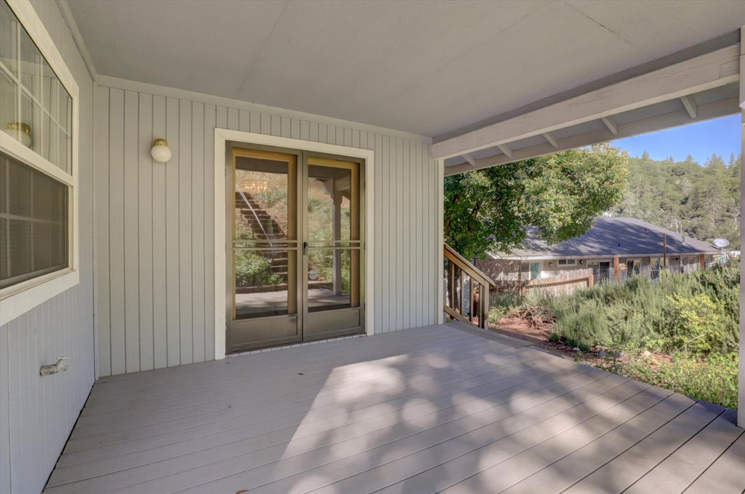 16479 Brewer Road Grass Valley, CA 95949 - Photo 24 of 33 a view of a yard with porch and wooden floor