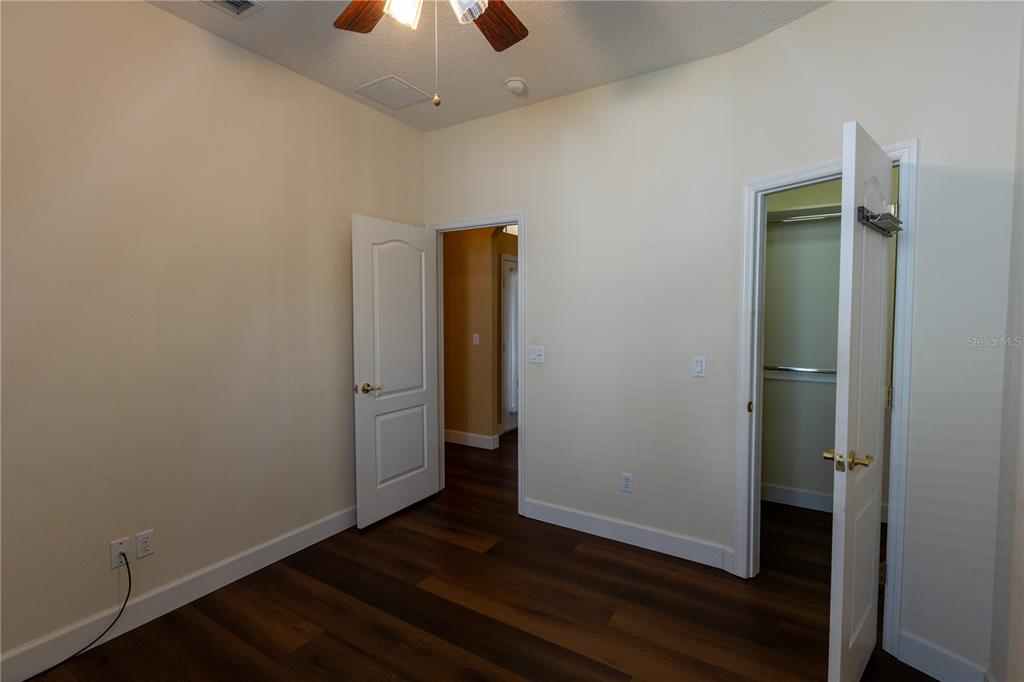 65 Calliope Street Ocoee, FL 34761 - Photo 24 of 60 an empty room with wooden floor and closet