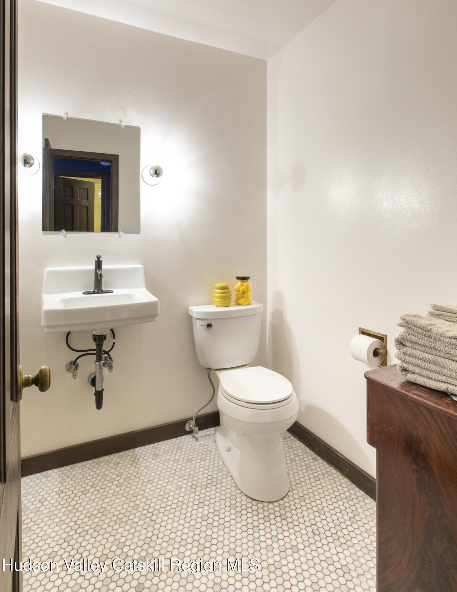 348 Willow Glen Road Red Hook, NY 12571 - Photo 16 of 29 a bathroom with a toilet a sink and mirror