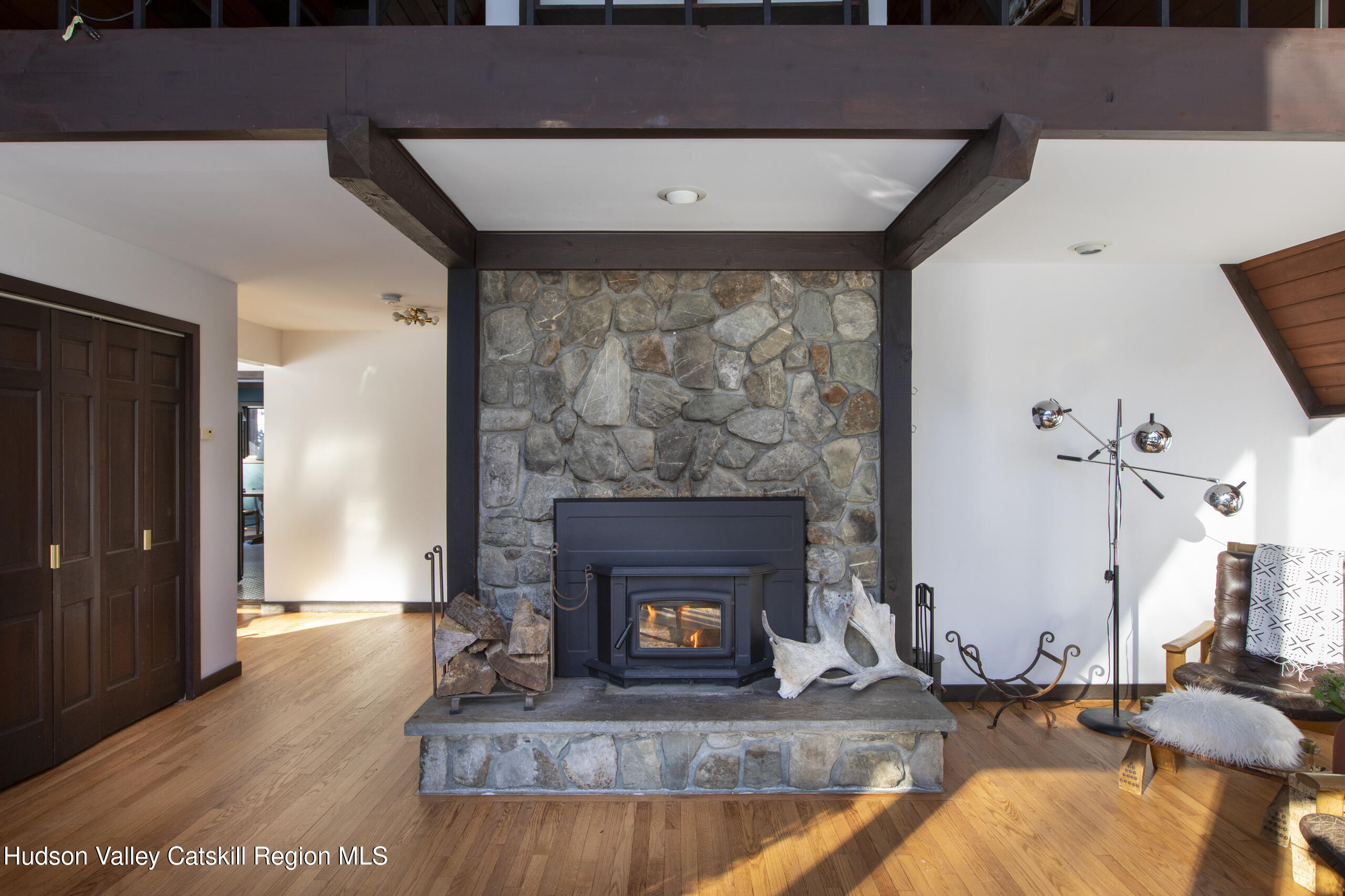 348 Willow Glen Road Red Hook, NY 12571 - Photo 5 of 29 a living room with furniture and a fireplace