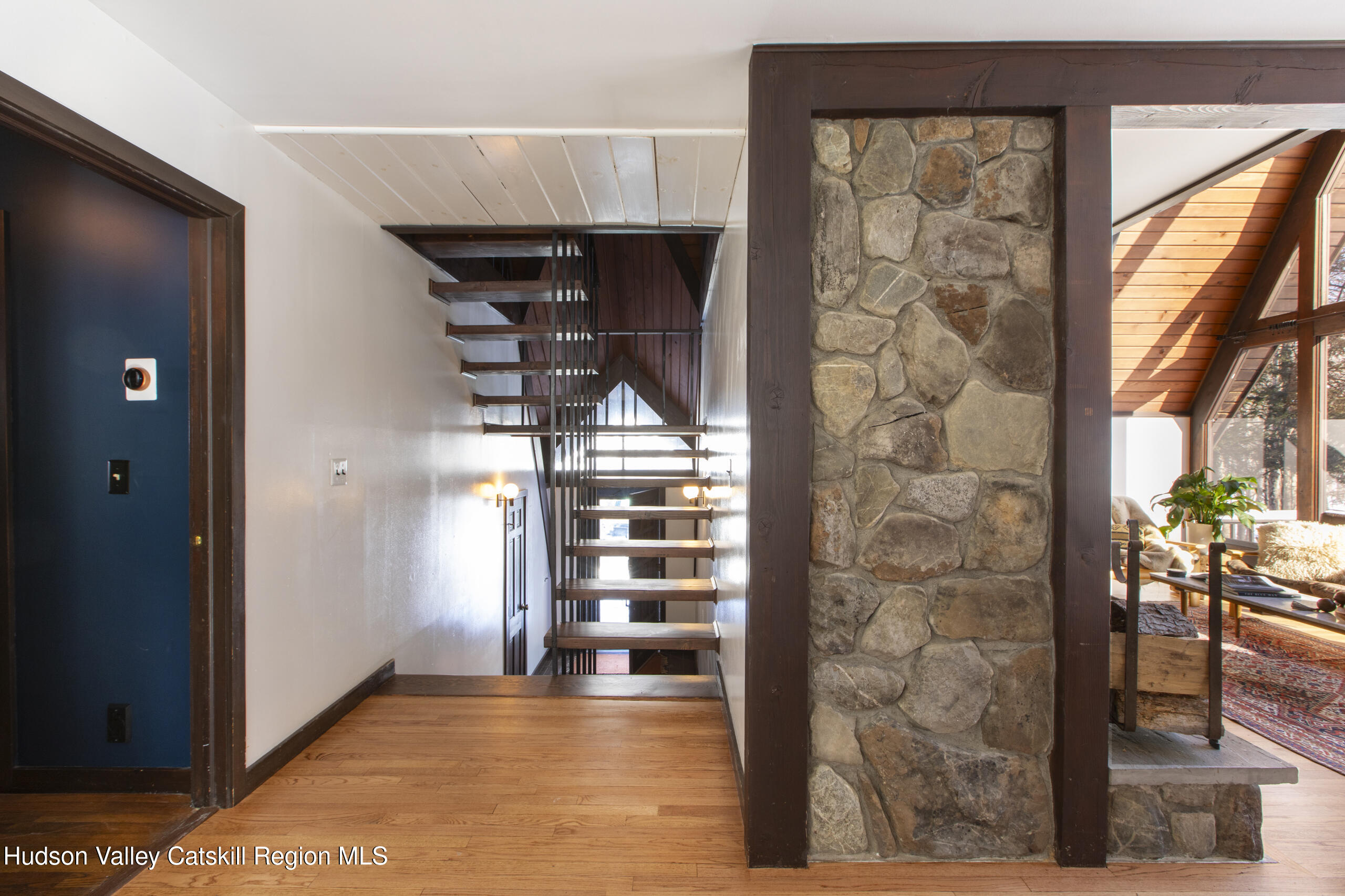 348 Willow Glen Road Red Hook, NY 12571 - Photo 6 of 29 a view of a hallway with wooden floor and windows