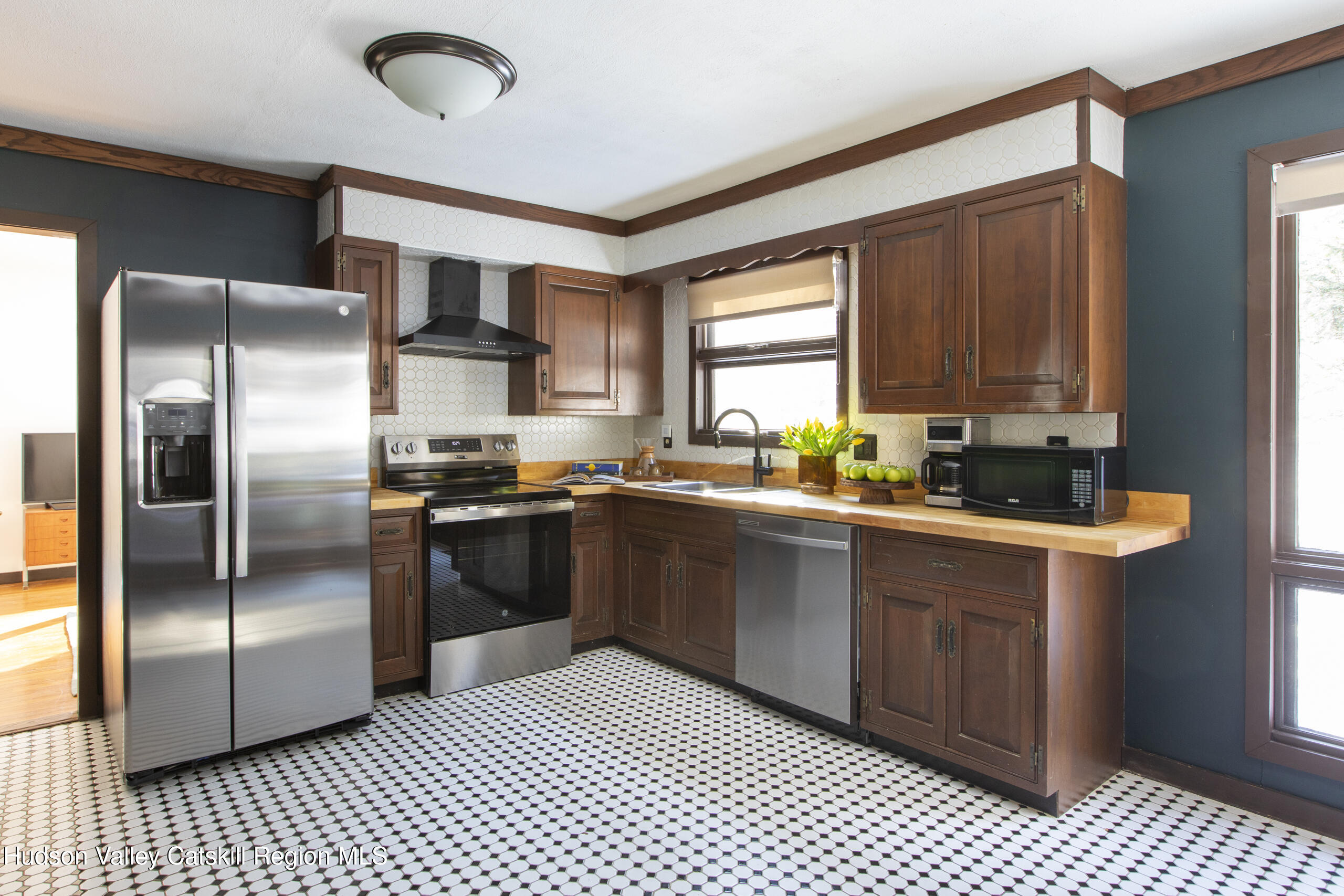 348 Willow Glen Road Red Hook, NY 12571 - Photo 9 of 29 a kitchen with stainless steel appliances granite countertop a refrigerator a sink a stove a microwave and island