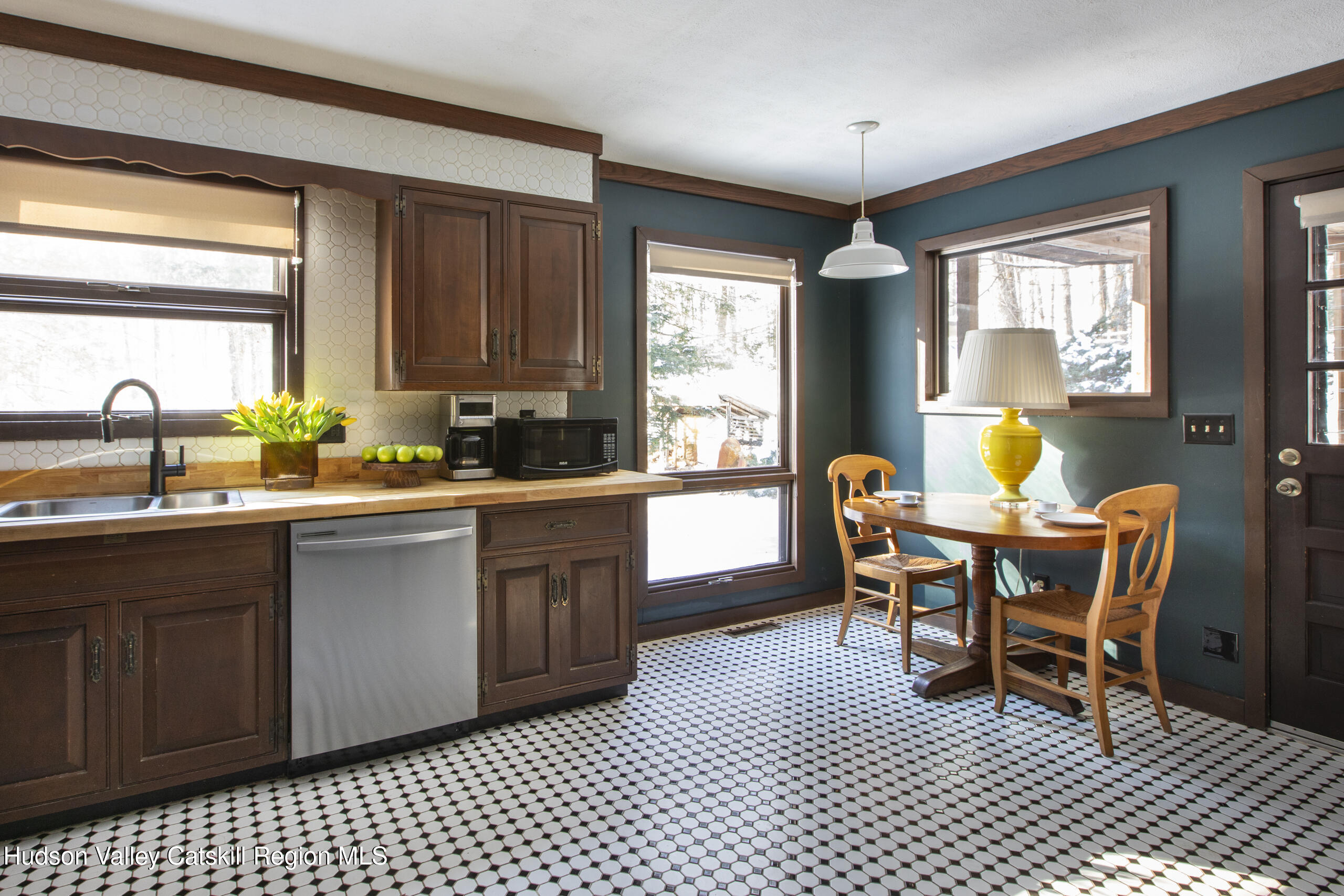 348 Willow Glen Road Red Hook, NY 12571 - Photo 10 of 29 a kitchen with a dining table chairs and large window
