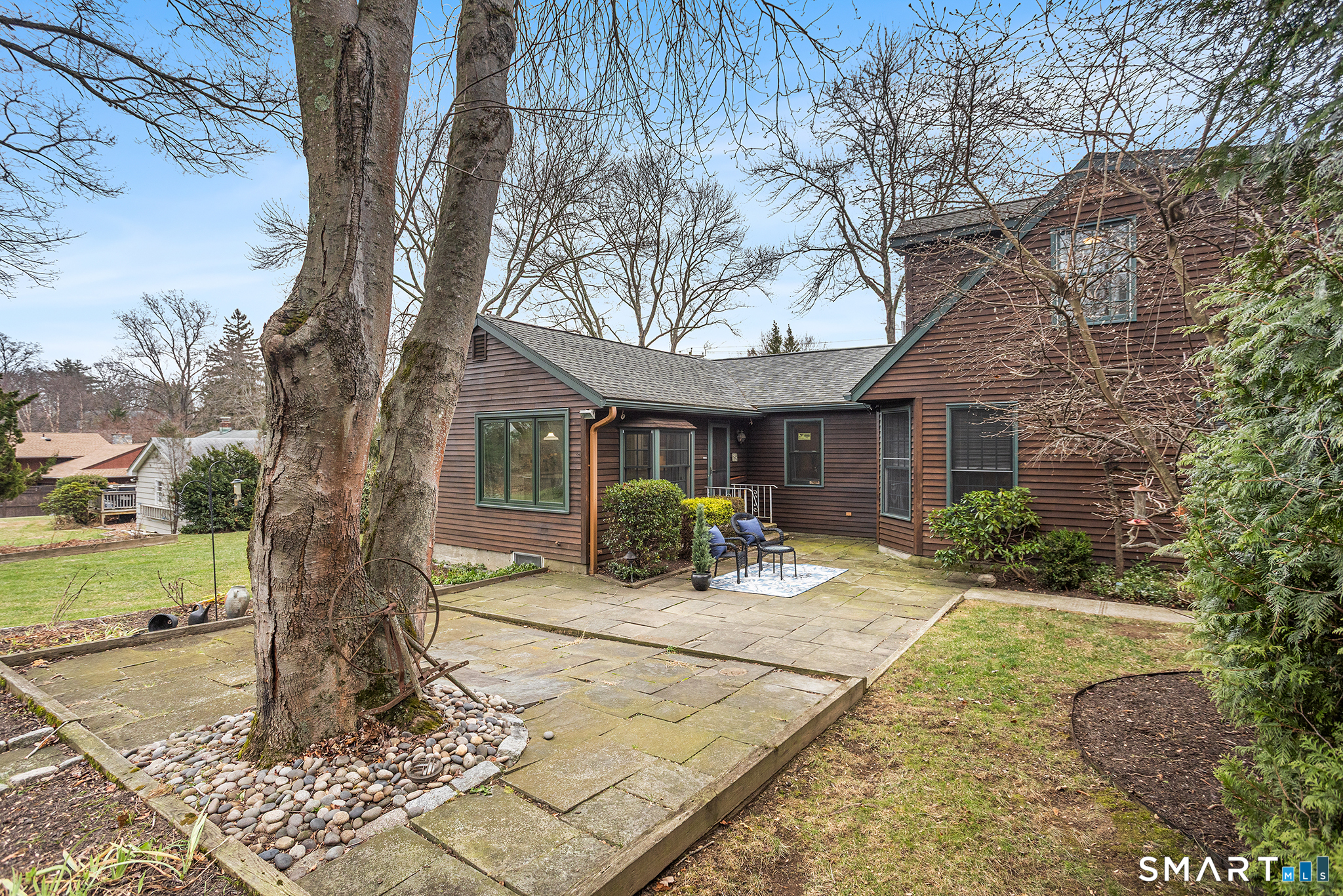 104 Putting Green Road Fairfield, CT 06825 - Photo 29 of 35 a front view of a house with yard patio and green space