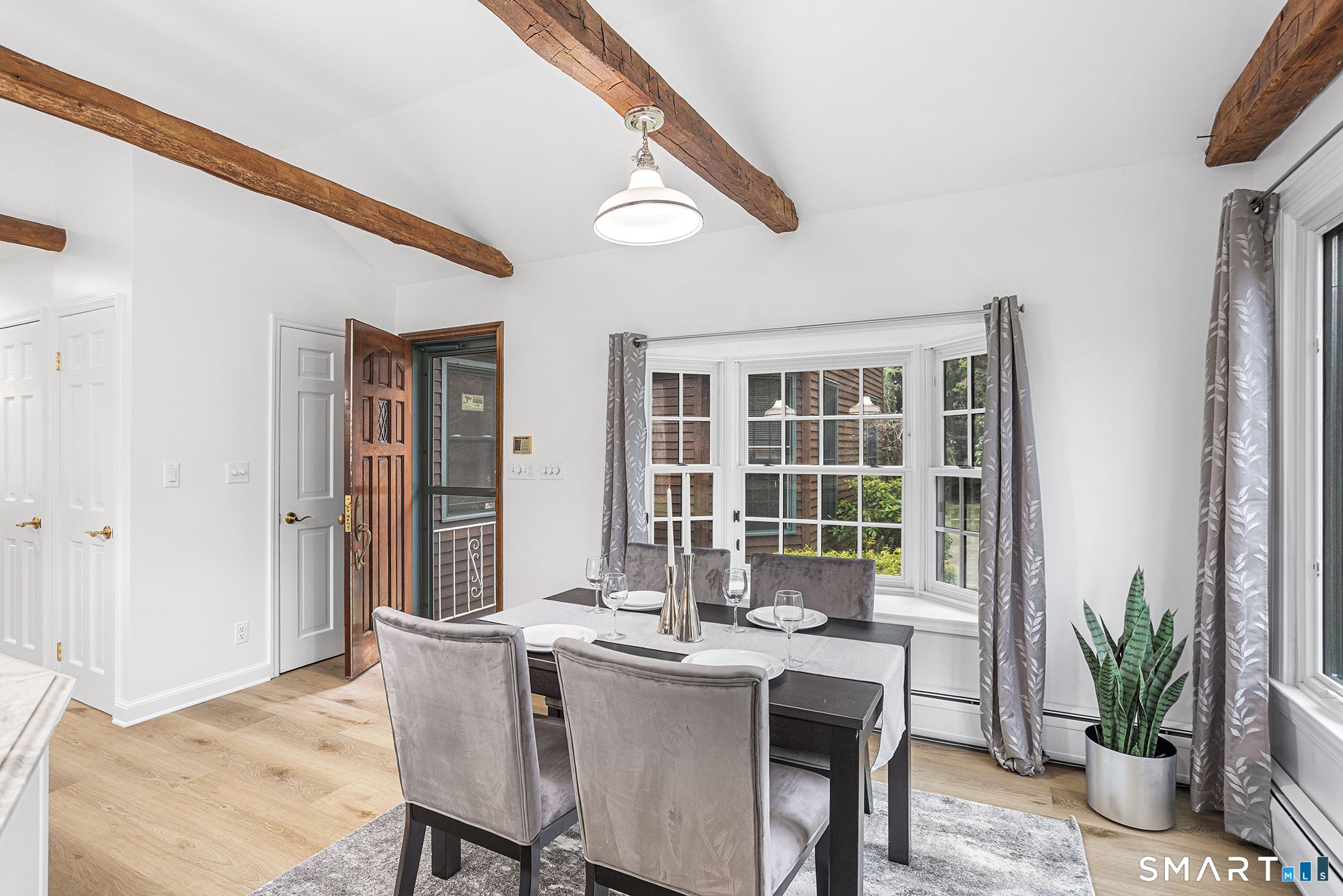 104 Putting Green Road Fairfield, CT 06825 - Photo 9 of 35 a dining room with furniture and window