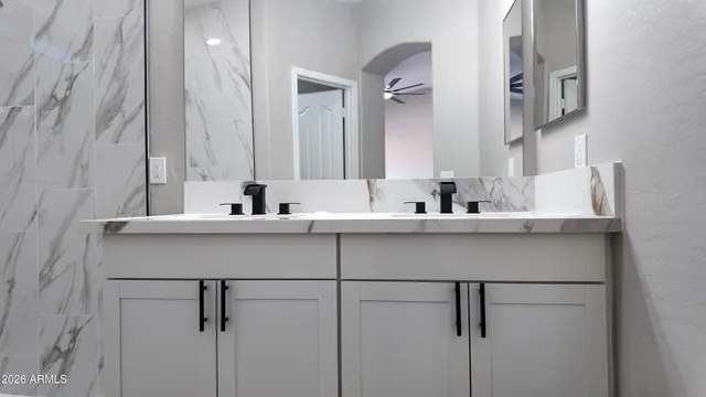 a bathroom with a sink and a mirror