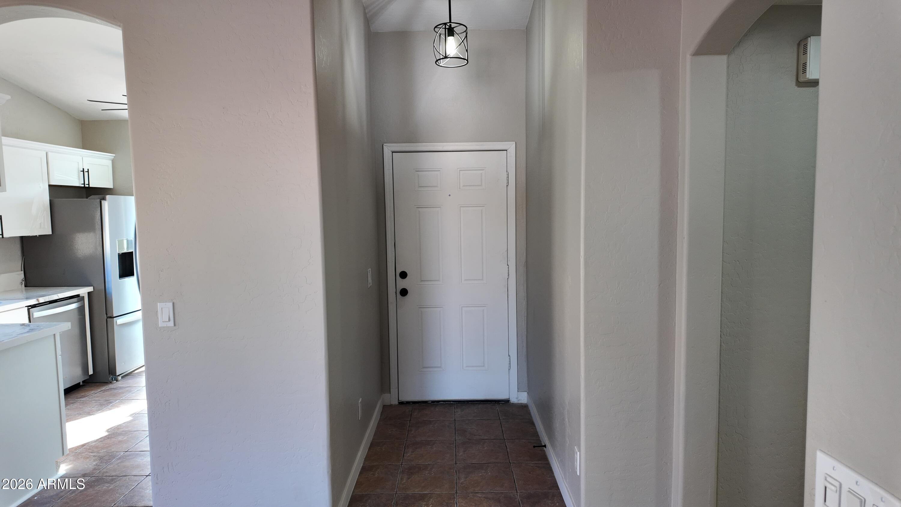 1522 East Chambers Street Phoenix, AZ 85040 - Photo 3 of 29 a view of a kitchen from the hallway