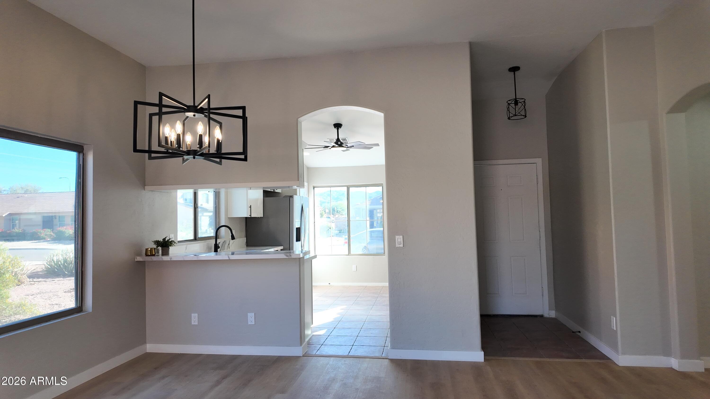 1522 East Chambers Street Phoenix, AZ 85040 - Photo 4 of 29 a dining hall with a window and a mirror