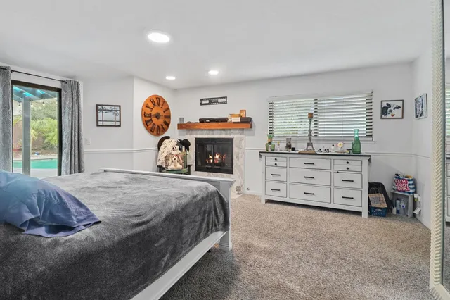 a bedroom with a bed and a tv