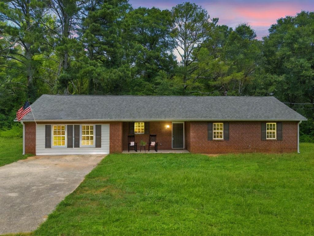a brick house that has a lots of windows in it