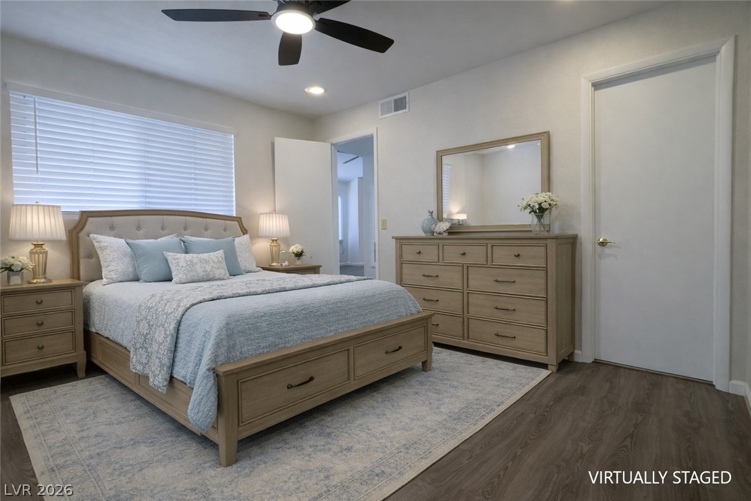 7570 West Flamingo Road, Unit 209 Las Vegas, NV 89147 - Photo 16 of 30 Bedroom featuring dark wood-type flooring, ceiling fan, and recessed lighting