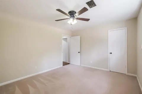 a bathroom with double vanity sinks and a mirror