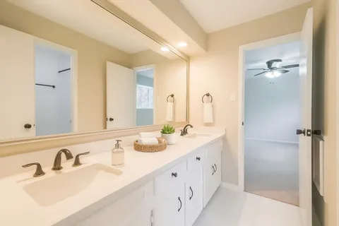 a bathroom with a shower and a shower head
