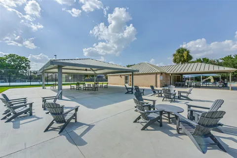 a view of a swimming pool with a yard