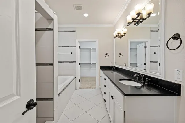 a bathroom with a sink double vanity and a mirror