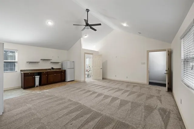 a view of a kitchen with a sink and cabinets