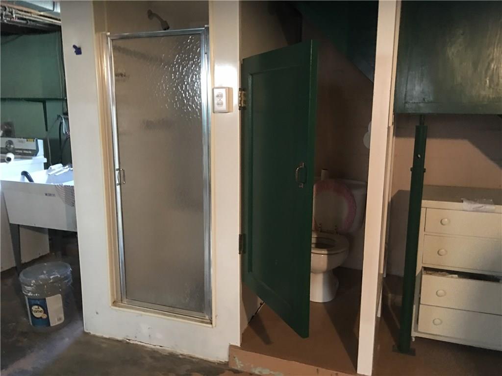13 Wallace Road Pittsburgh, PA 15209 - Photo 14 of 17 The enclosed shower and commode make up the half bath in the basement.