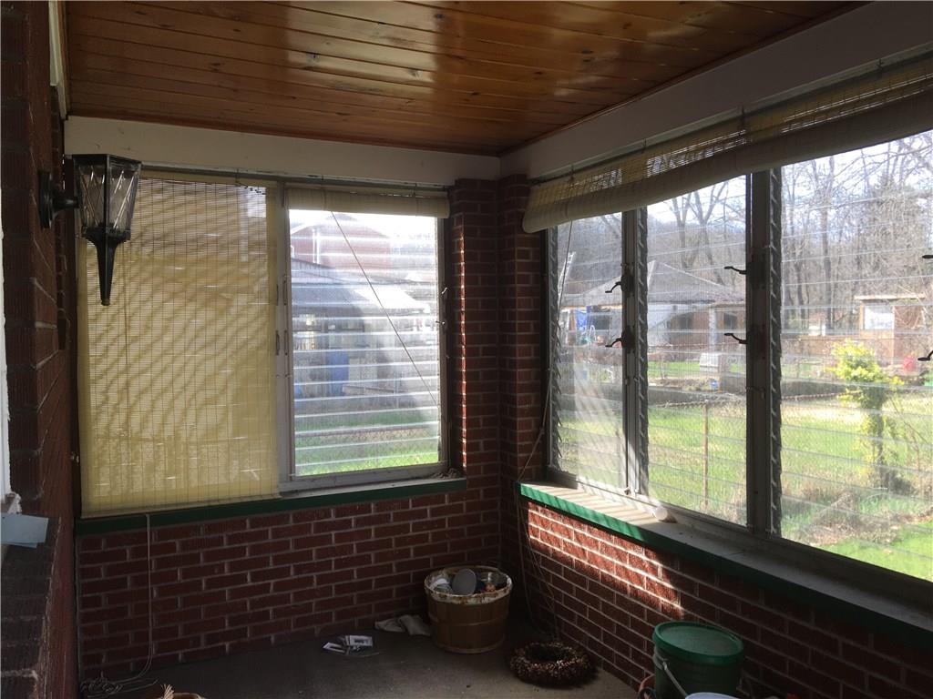 13 Wallace Road Pittsburgh, PA 15209 - Photo 10 of 17 Imagine spending time in this room just off the kitchen with many windows and finished ceiling. It overlooks the back yard.
