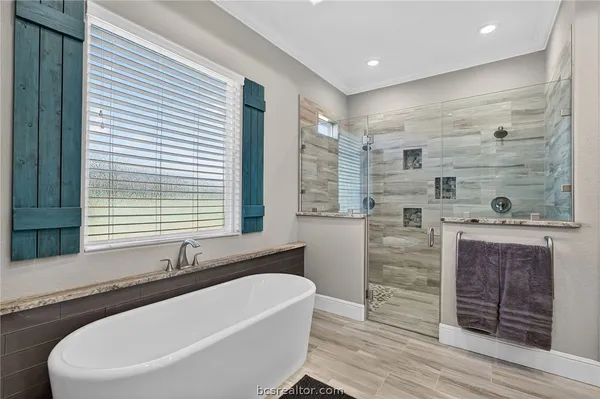 a bathroom with a bathtub and a sink