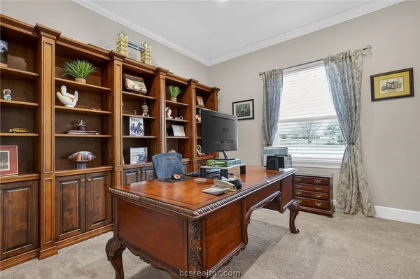 a reading room with furniture and a book shelf