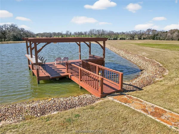 a view of a roof deck with lake view