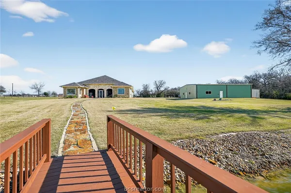 a view of swimming pool with an outdoor seating