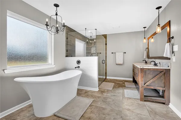 a bathroom with a double vanity sink and mirror