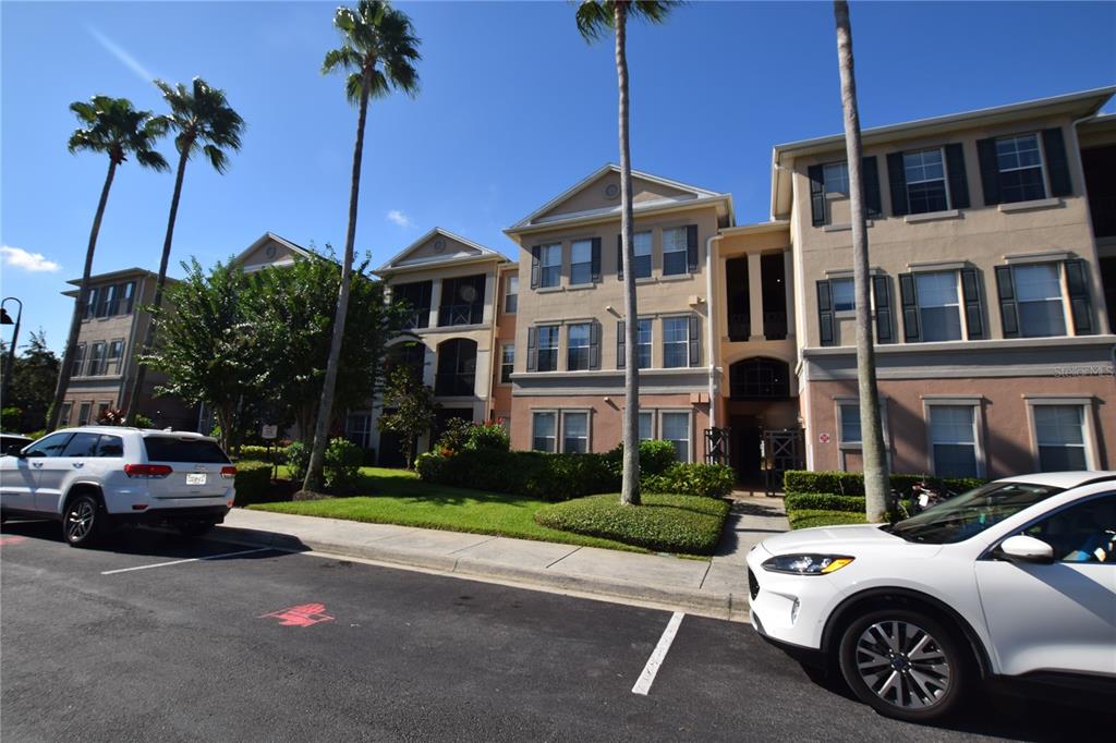 8168 Boat Hook Loop, Unit 725 Windermere, FL 34786 - Photo 1 of 35 a view of a car parked in front of a building