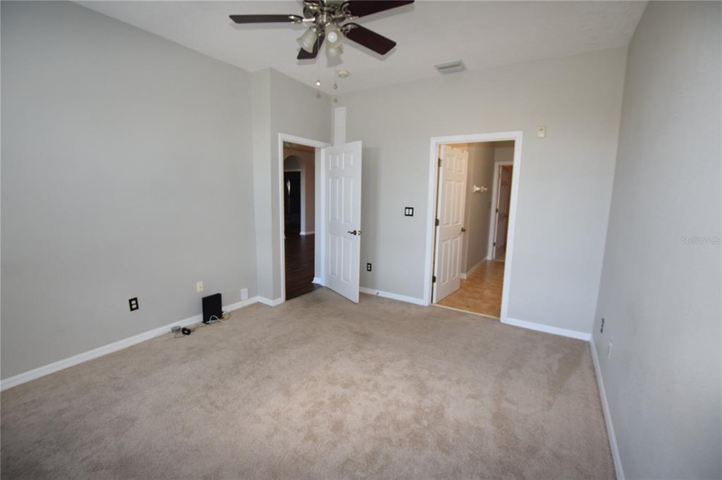8168 Boat Hook Loop, Unit 725 Windermere, FL 34786 - Photo 20 of 35 a view of an empty room and a ceiling fan