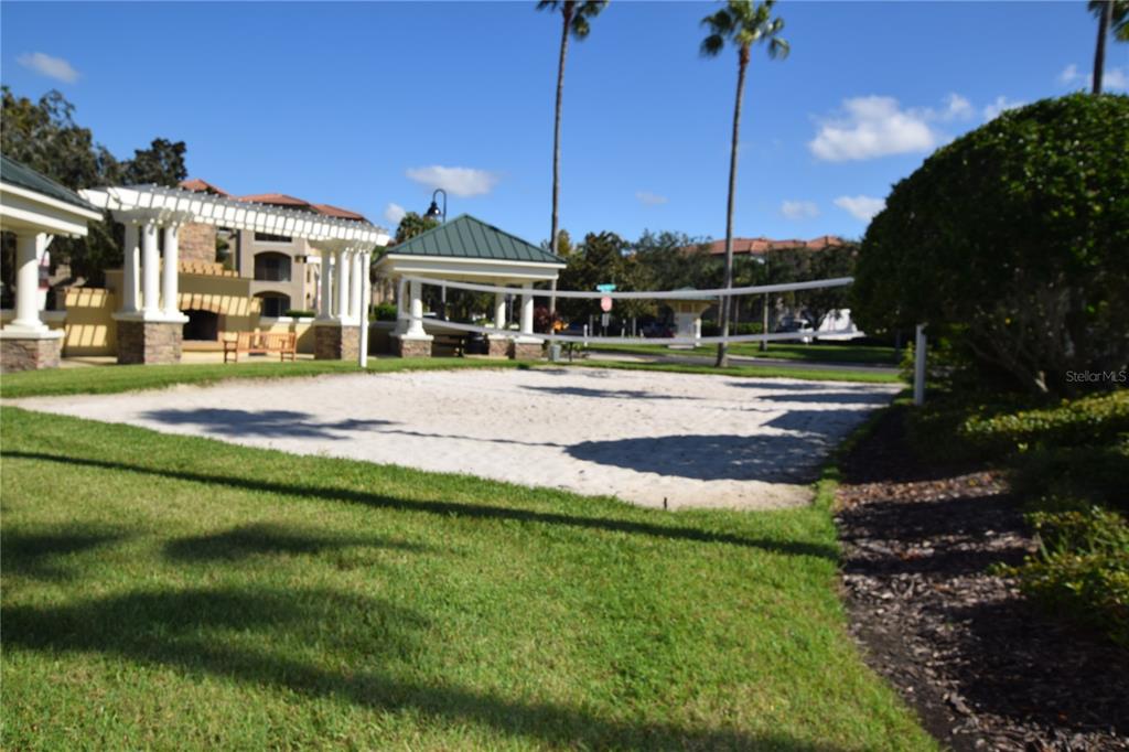 8168 Boat Hook Loop, Unit 725 Windermere, FL 34786 - Photo 35 of 35 a view of a big house with a big yard and potted plants
