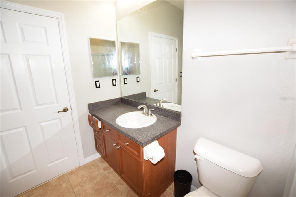 8168 Boat Hook Loop, Unit 725 Windermere, FL 34786 - Photo 9 of 35 a bathroom with a sink and a mirror with toilet