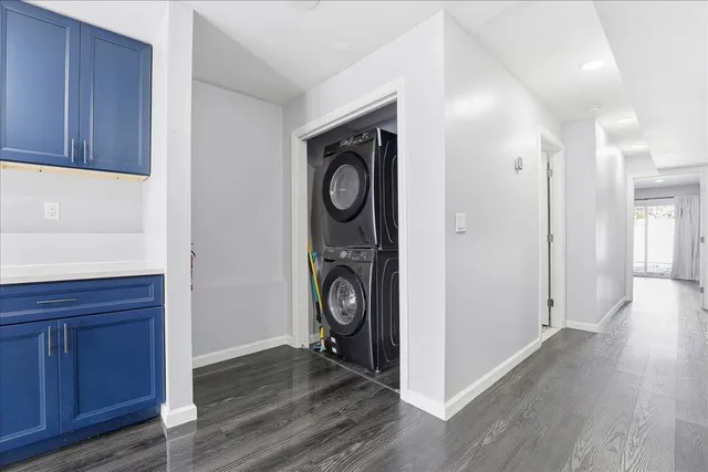 a view of an entryway with wooden floor