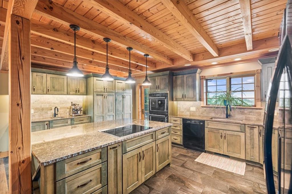 239 Christy Road Eighty Four, PA 15330 - Photo 11 of 50 a large kitchen with kitchen island a large window a sink and stainless steel appliances