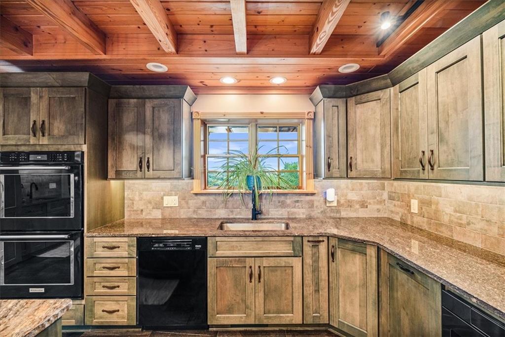 239 Christy Road Eighty Four, PA 15330 - Photo 12 of 50 a kitchen with stainless steel appliances granite countertop a sink stove and cabinets