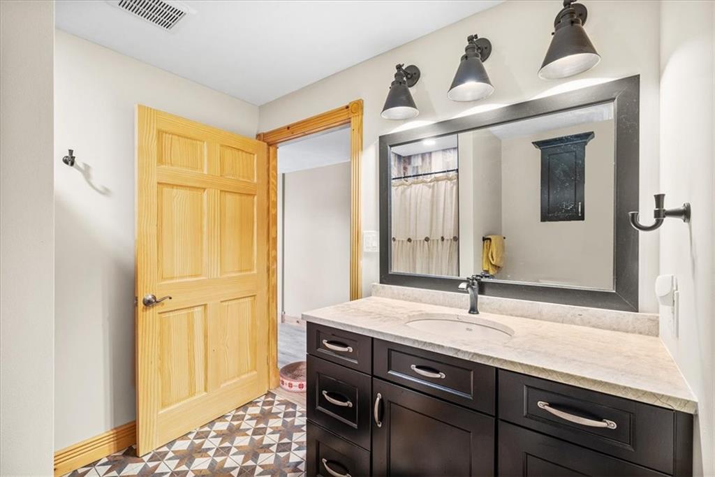 239 Christy Road Eighty Four, PA 15330 - Photo 30 of 50 a bathroom with a sink and a mirror