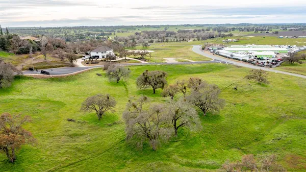 a view of a swimming pool with a yard