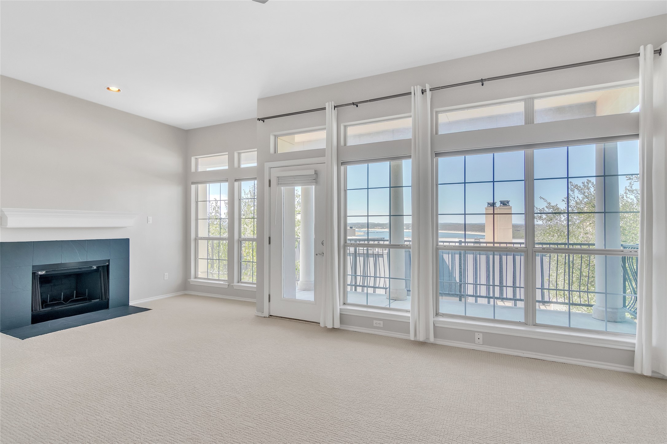 2918 Ranch Road 620 North, Unit 281 Austin, TX 78734 - Photo 11 of 32 a view of an empty room with a fireplace and a window