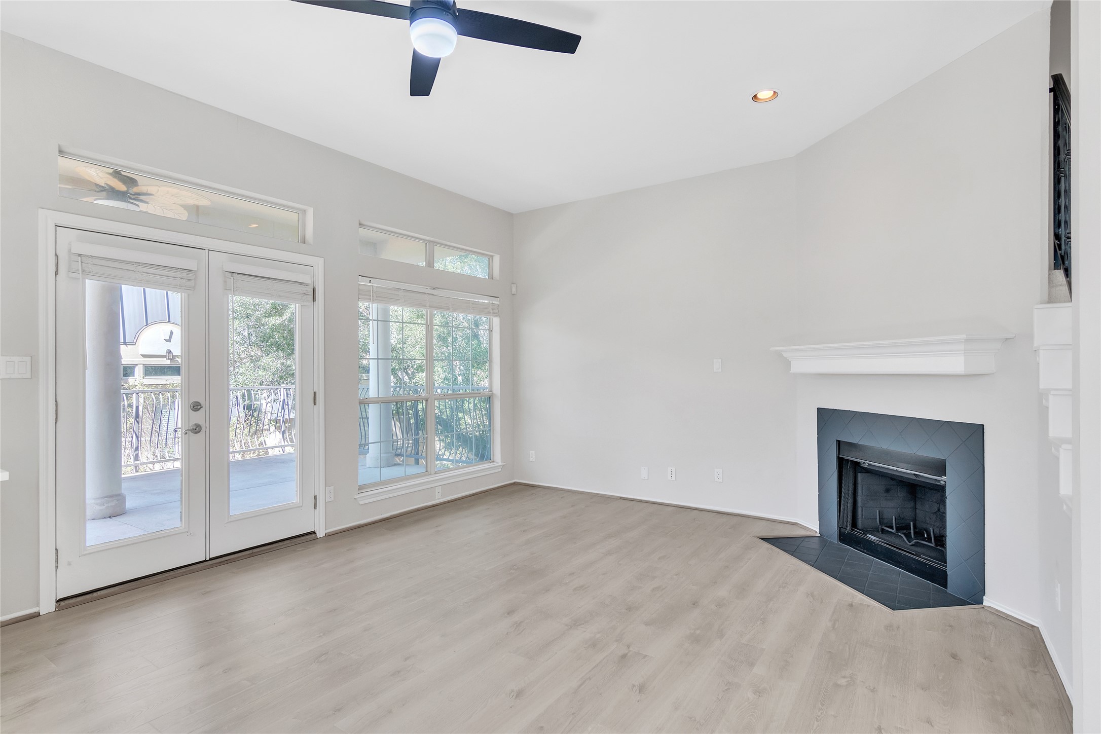 2918 Ranch Road 620 North, Unit 281 Austin, TX 78734 - Photo 7 of 32 a view of an empty room with fireplace and a window