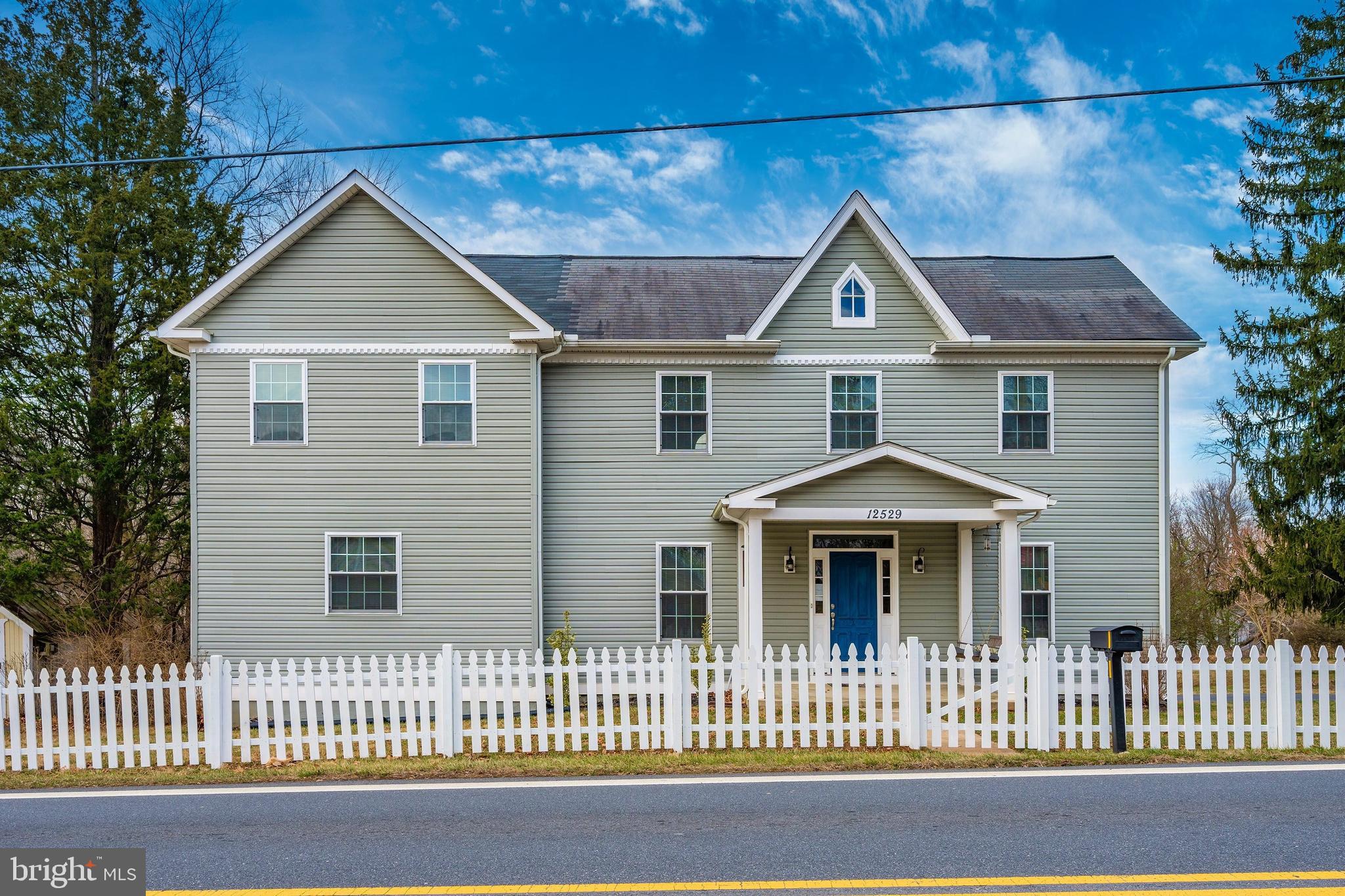 12529 Fingerboard Road Monrovia, MD 21770 - Photo 1 of 55 a house view with a garden and deck