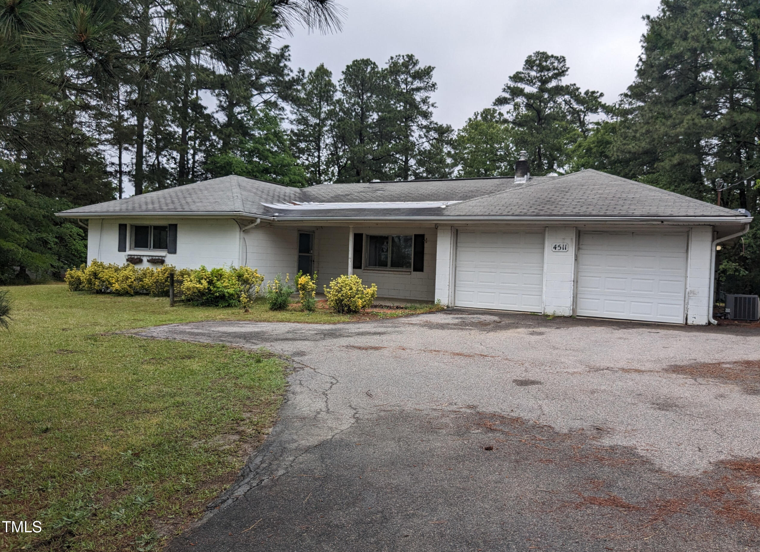 4511 Hopson Road Morrisville, NC 27560 - Photo 2 of 7 a front view of a house with garden