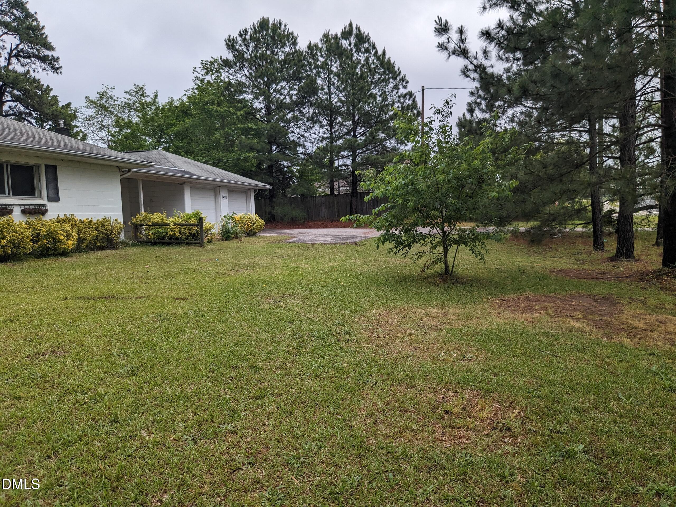 4511 Hopson Road Morrisville, NC 27560 - Photo 6 of 7 a view of a backyard with large trees