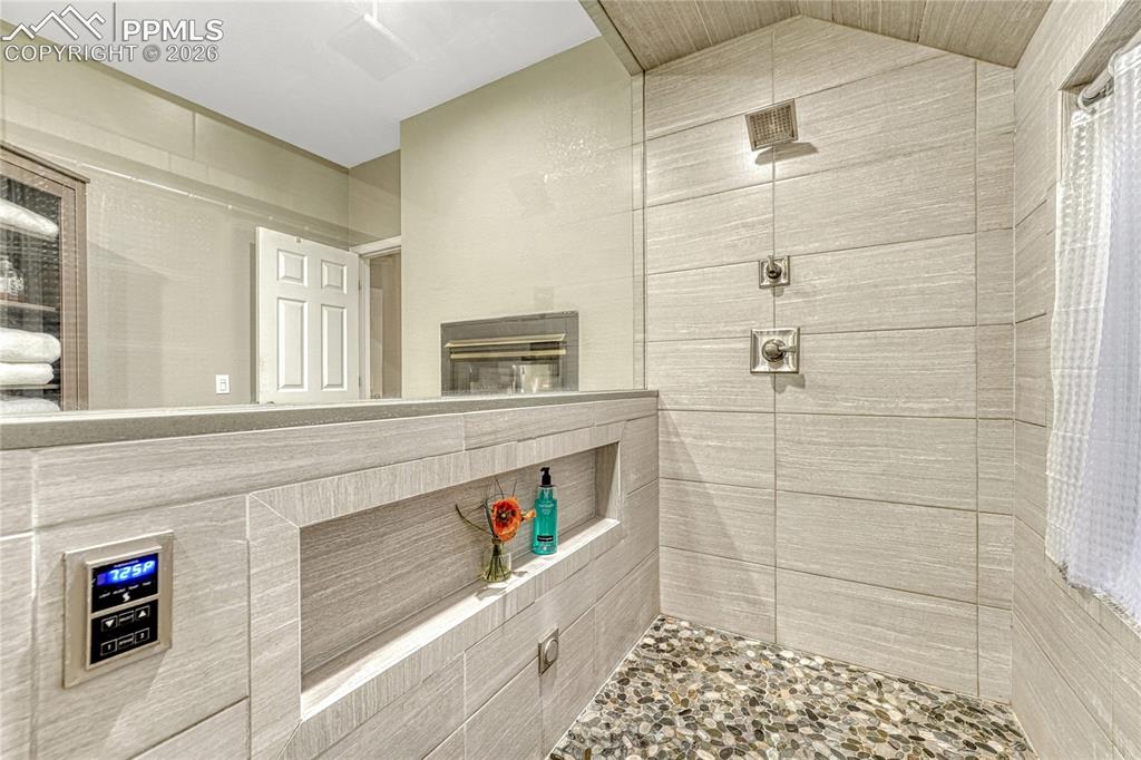 15585 Falcon Ridge Court Colorado Springs, CO 80921 - Photo 21 of 50 a bathroom with a sink a toilet and shower